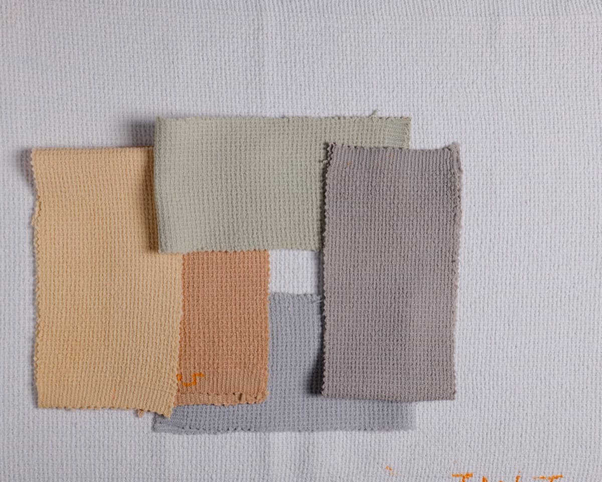 Overlapping fabric swatches in earth tones