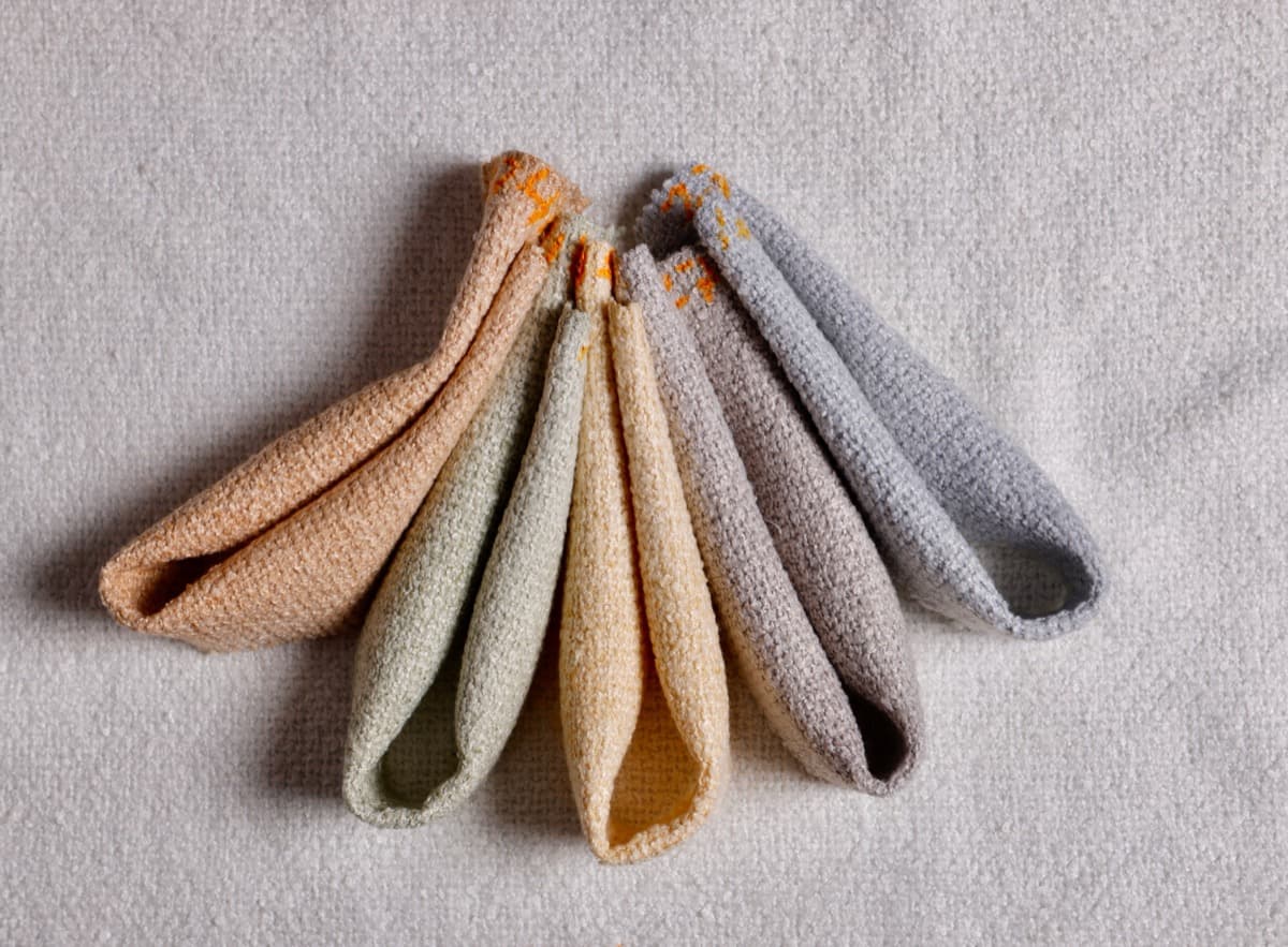 Folded fabric fan arrangement